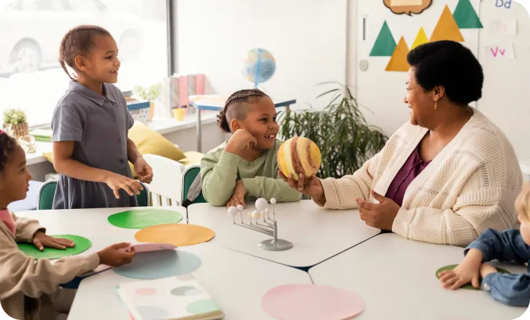 Students and teacher in classroom using visual learning supports